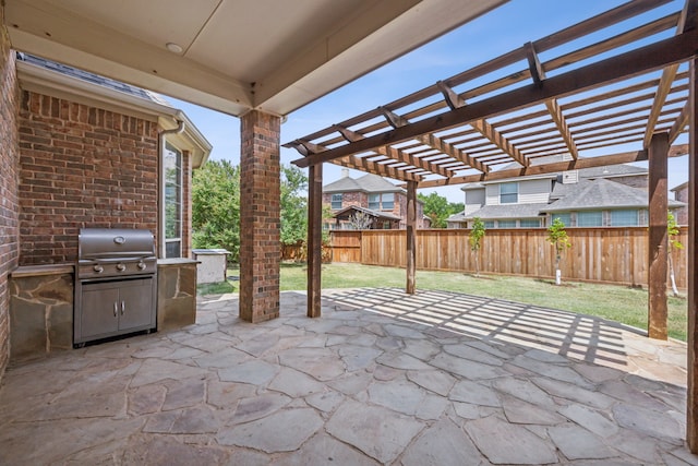 view of patio / terrace featuring a pergola and area for grilling