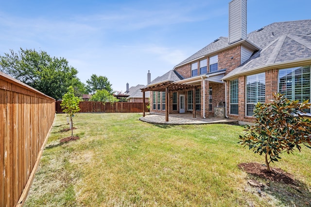 view of yard with a pergola and a patio area