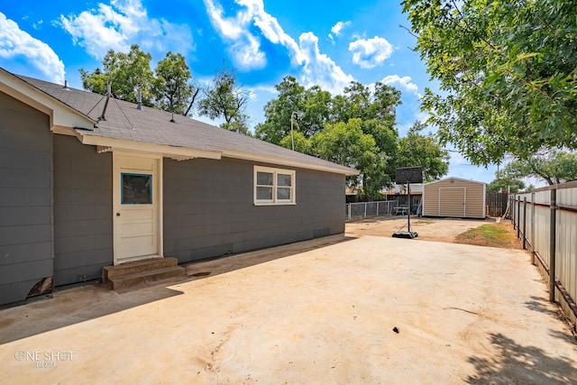 view of patio / terrace featuring a storage unit