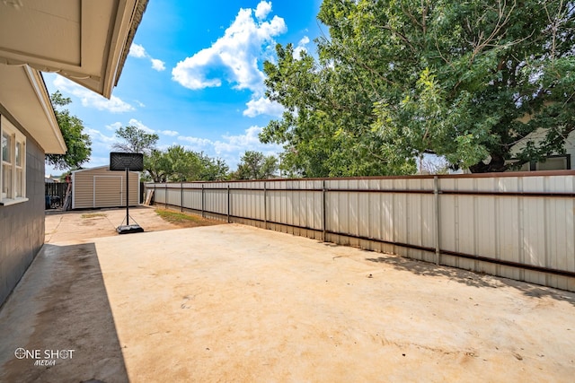 view of yard with a patio area and a shed