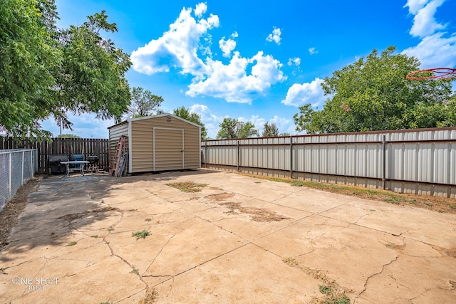 view of patio / terrace with a shed