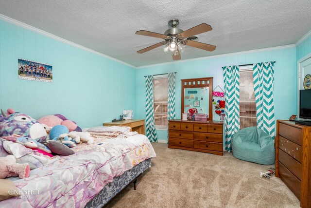 bedroom featuring a textured ceiling, ceiling fan, light colored carpet, and crown molding