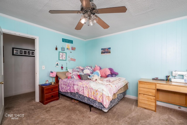 carpeted bedroom with ceiling fan, crown molding, and a textured ceiling