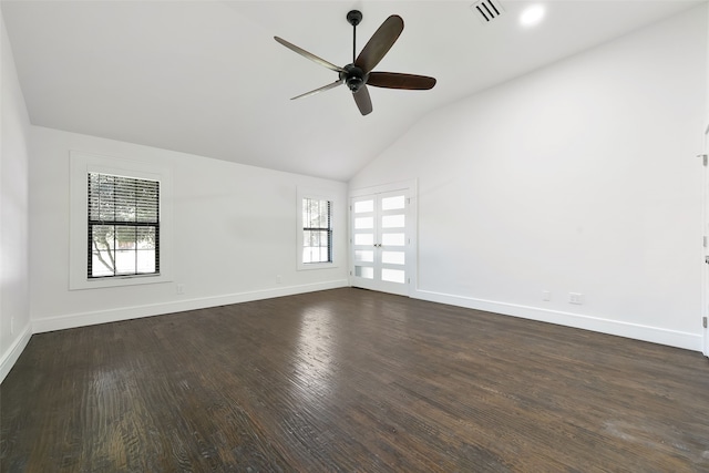 empty room featuring dark hardwood / wood-style flooring, ceiling fan, and lofted ceiling