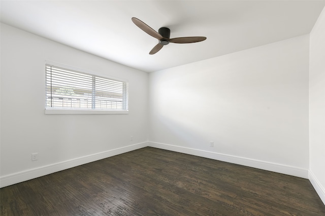 spare room featuring dark hardwood / wood-style floors and ceiling fan