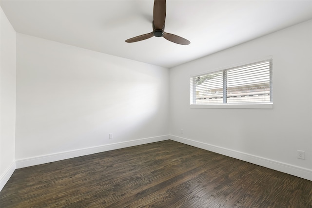 unfurnished room with ceiling fan and dark wood-type flooring