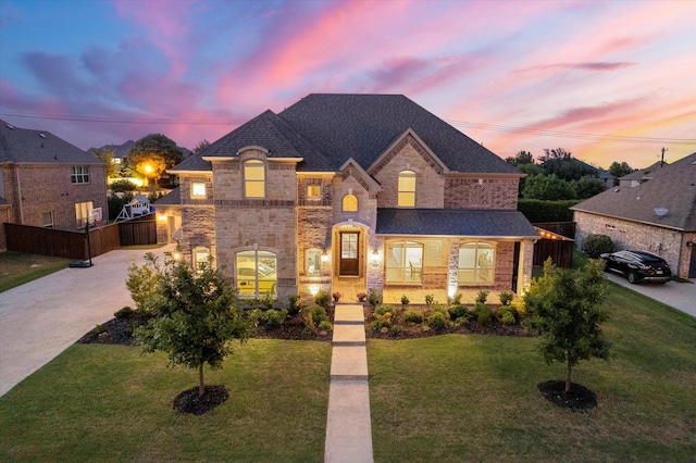 french country style house featuring a yard