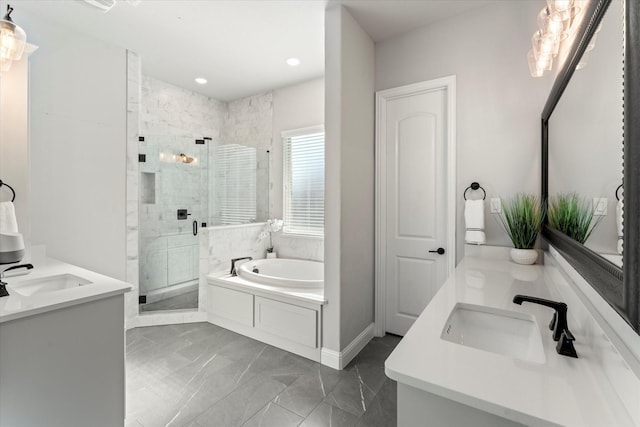 bathroom featuring vanity and separate shower and tub