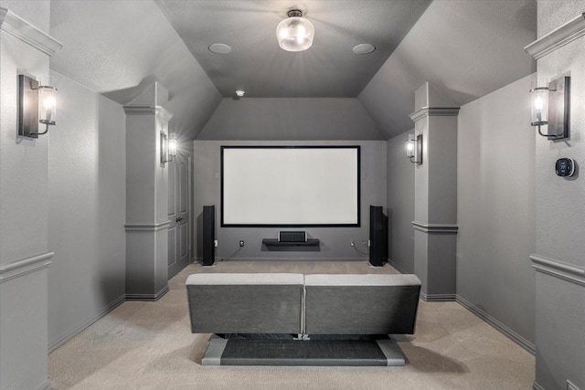 carpeted cinema room featuring lofted ceiling