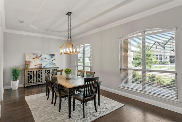 dining area featuring plenty of natural light, dark hardwood / wood-style floors, and a notable chandelier