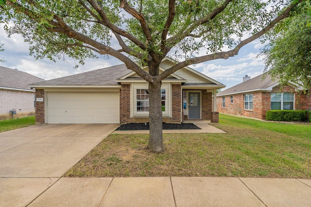 view of front facade with a garage and a front lawn