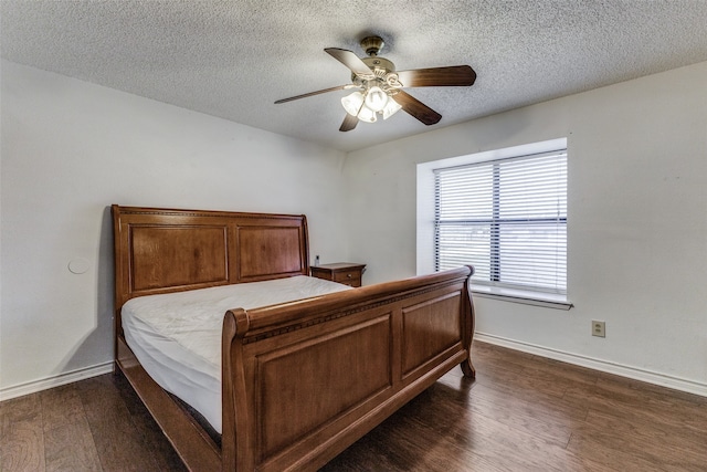 bedroom featuring a textured ceiling, dark hardwood / wood-style floors, and ceiling fan