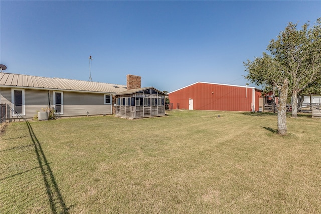 view of yard with a sunroom