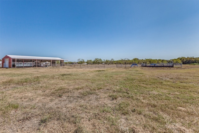 view of yard with a rural view