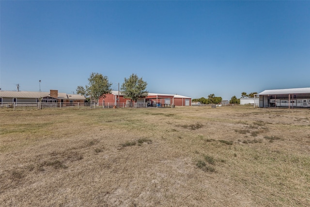 view of yard with a rural view