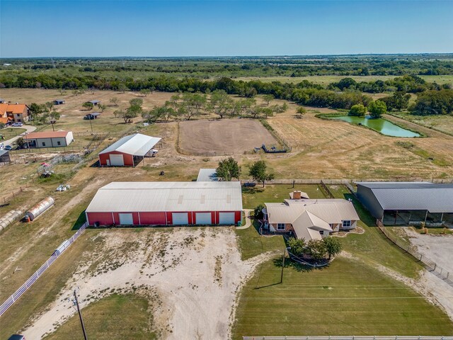 drone / aerial view with a water view and a rural view