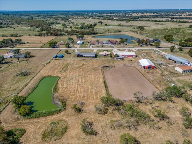 bird's eye view featuring a water view and a rural view