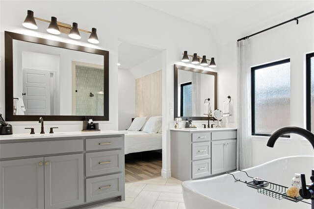 bathroom with vanity and hardwood / wood-style floors