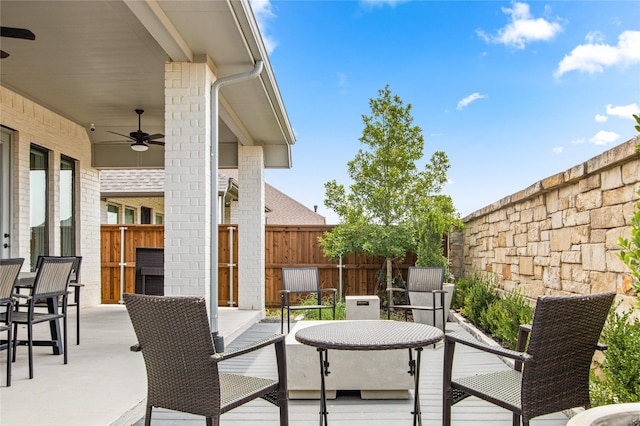 view of patio / terrace featuring a ceiling fan and fence