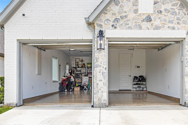 garage with concrete driveway