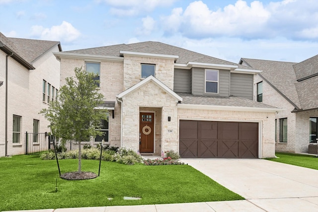 view of front facade featuring a garage and a front yard