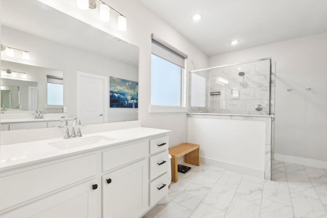 bathroom with vanity and a shower with shower door