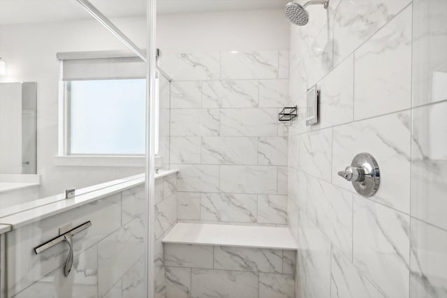 bathroom featuring a tile shower