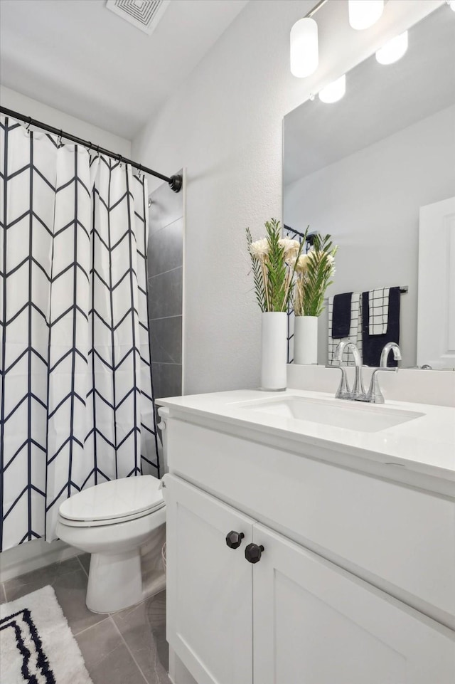 bathroom with vanity, a shower with curtain, and toilet