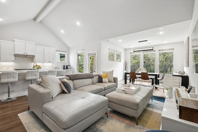 living room with beam ceiling, dark wood-type flooring, and high vaulted ceiling