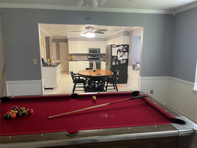 recreation room featuring crown molding and ceiling fan