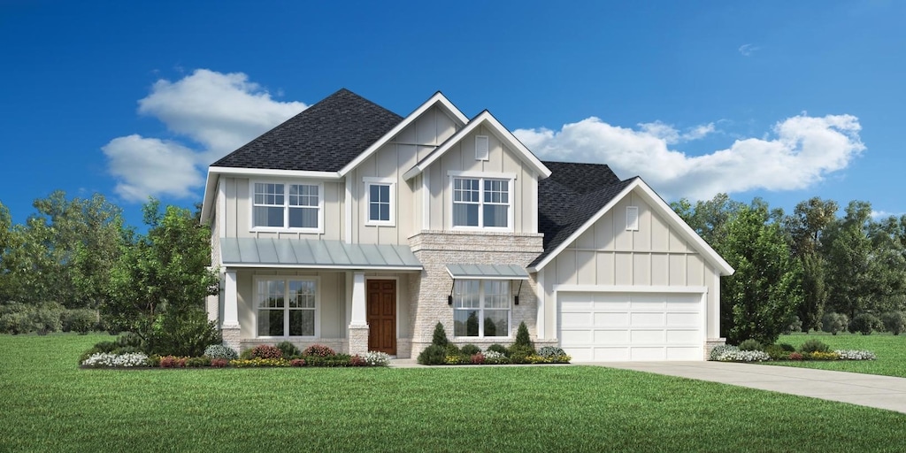 view of front of property with a garage and a front yard