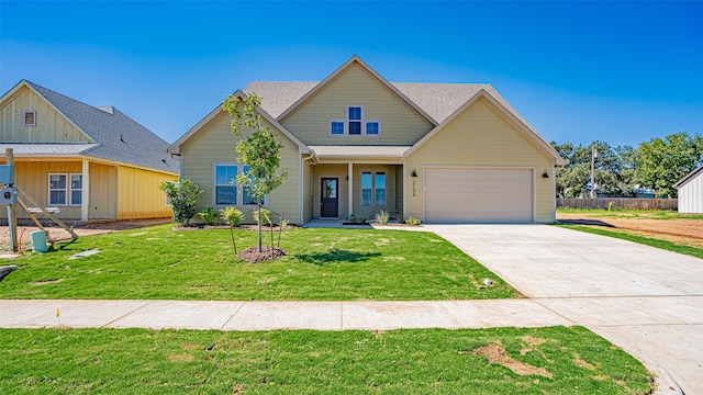 view of front of home featuring a garage and a front lawn