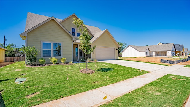 view of front of property with a garage and a front lawn