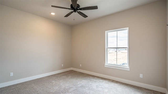 carpeted empty room with ceiling fan