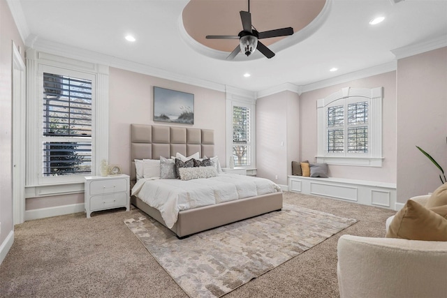 bedroom featuring multiple windows, ornamental molding, carpet flooring, and ceiling fan