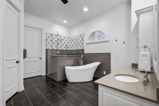 bathroom featuring tile patterned flooring, ornamental molding, shower with separate bathtub, and vanity