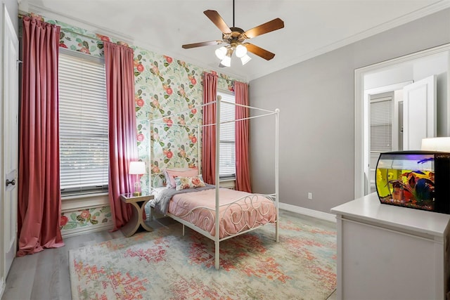 bedroom with multiple windows, ornamental molding, light wood-type flooring, and ceiling fan