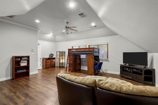 living room featuring vaulted ceiling, hardwood / wood-style floors, ornamental molding, ceiling fan, and a textured ceiling