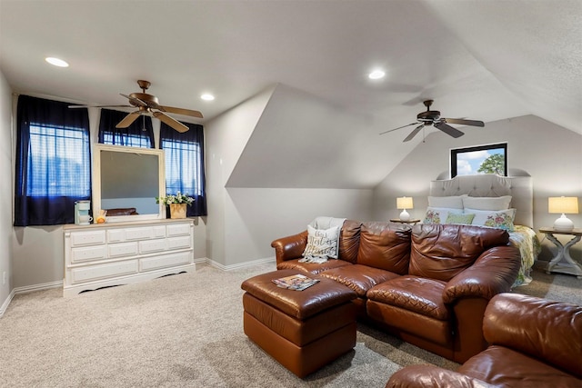 interior space with ceiling fan, carpet flooring, and vaulted ceiling