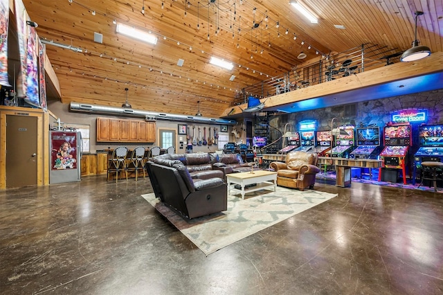 living room with wooden ceiling and high vaulted ceiling