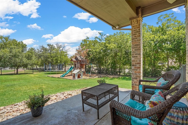 view of patio with a playground and a trampoline