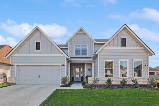 view of front of home featuring board and batten siding, concrete driveway, brick siding, and a front lawn