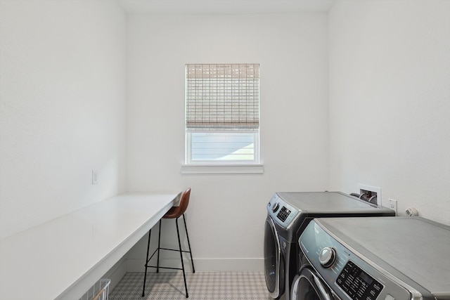 clothes washing area featuring washing machine and clothes dryer and carpet flooring