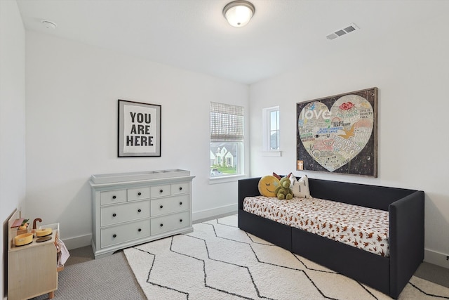 bedroom with light carpet