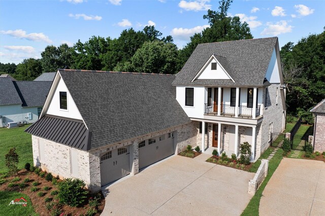 view of front of house with a porch and a balcony