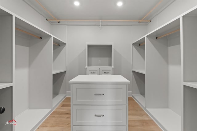 spacious closet with light hardwood / wood-style floors