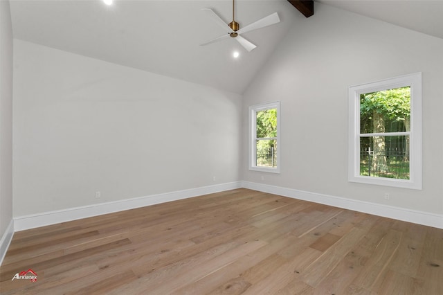 spare room featuring beam ceiling, high vaulted ceiling, ceiling fan, and light hardwood / wood-style floors