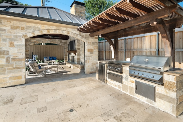 view of patio with grilling area, area for grilling, and a pergola