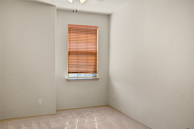 unfurnished room featuring carpet flooring