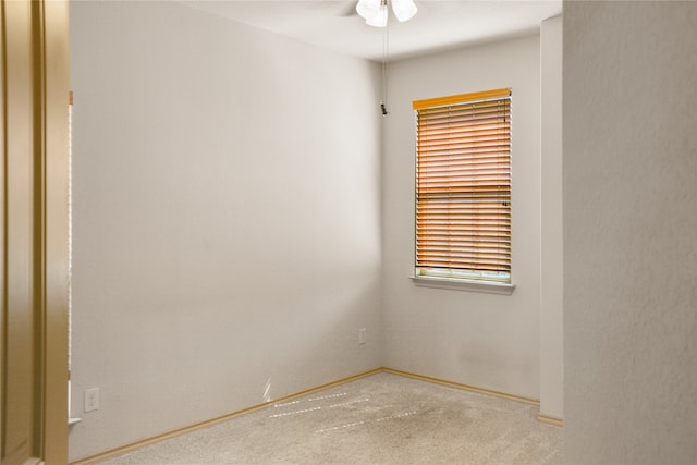 unfurnished room featuring light carpet